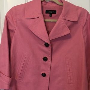 Rose color blazer with large brown buttons.